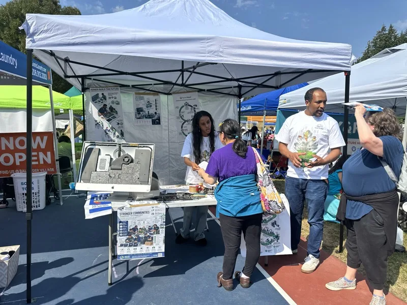 Wide view of the outreach booth at a community event