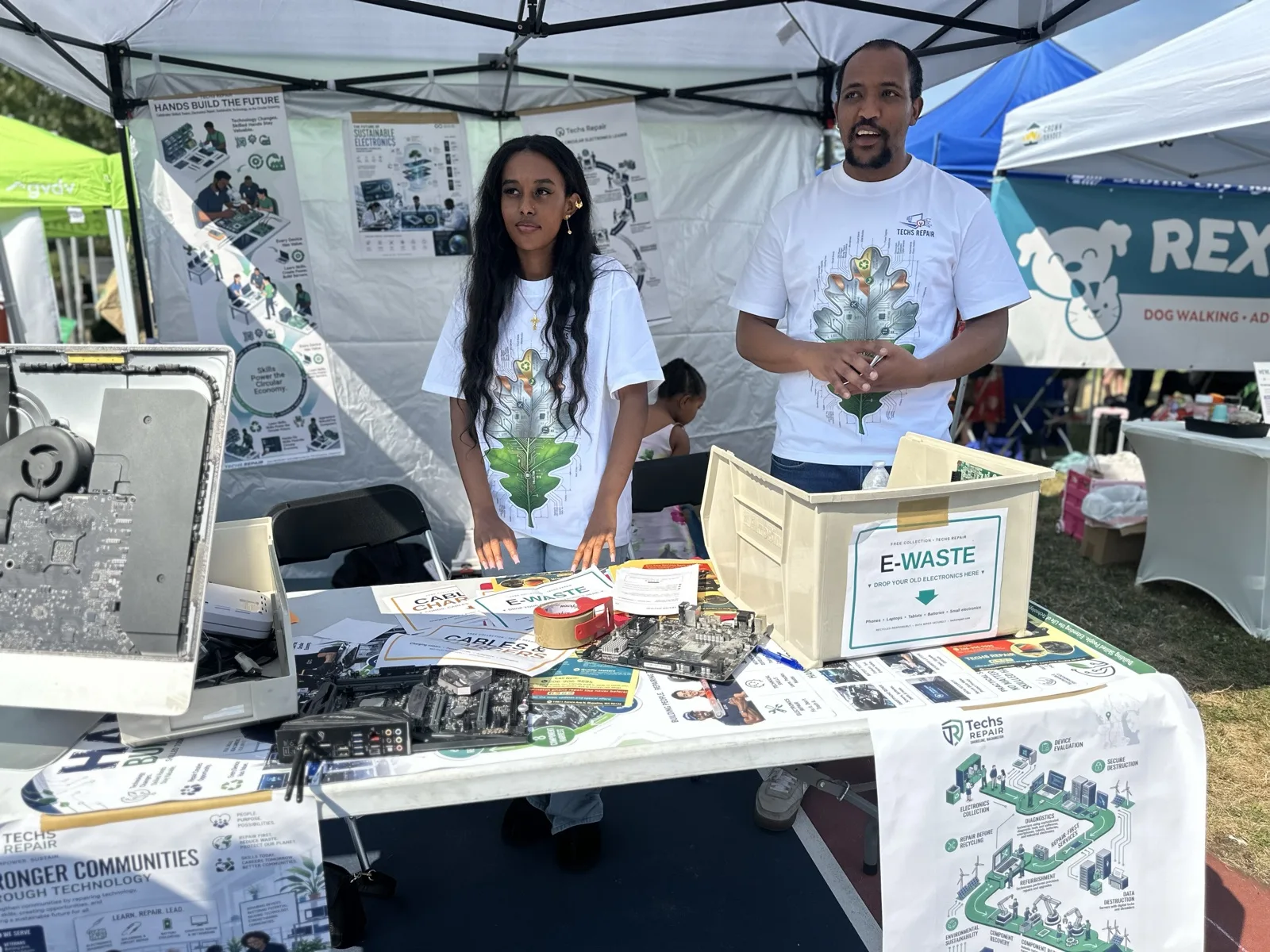 Techs Repair team members staffing an electronics reuse outreach booth